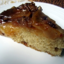 slice of upside-down caramel apple cake on a plate