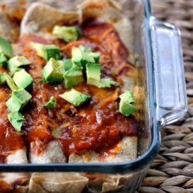 Incredible skinny huevos rancheros breakfast enchiladas rolled up with protein packed scrambled eggs, fresh veggies, and melty cheese, then baked in a delicious enchilada sauce. Perfect for breakfast meal prep or weekend brunch!