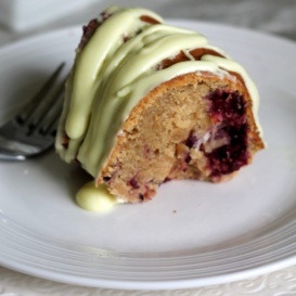 Gorgeous lemon bundt cake made with fresh blackberries, greek yogurt, a zesty lemon cream cheese glaze, and lightened up to perfection with less butter.