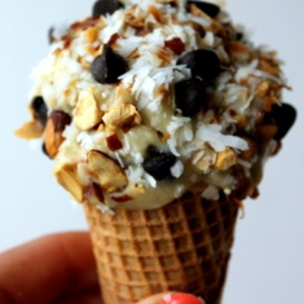 Delicious, healthy banana ice cream topped with toasted coconut, almonds, and rich dark chocolate. This dairy free, vegan banana ice cream comes together in just a few minutes and tastes just like an Almond Joy.
