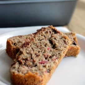 Dark chocolate raspberry oatmeal banana bread baked to perfection with oat flour, minimal added sugar, juicy raspberries, and creamy dark chocolate.