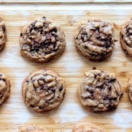 Peanut butter chocolate chip cookies on a wooden board