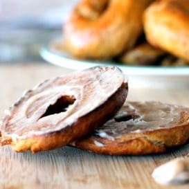 homemade pumpkin bagel sliced with butter on top