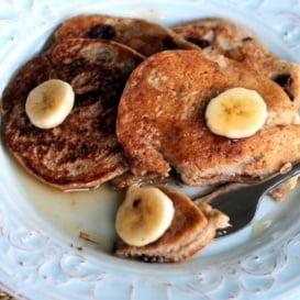 Oatmeal chocolate chip banana pancakes on a plate