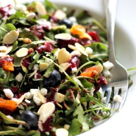 blueberry arugula salad with fruit, goat cheese, and nuts