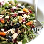 blueberry arugula salad with fruit, goat cheese, and nuts