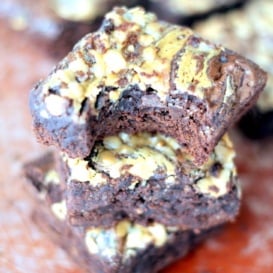 stack of chocolate brownies topped with toffee