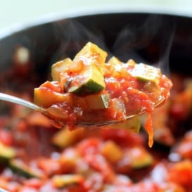 spoon of homemade tomato sauce with zucchini