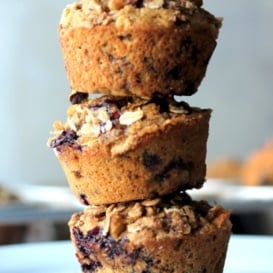 stack of blueberry applesauce muffins with oat streusel