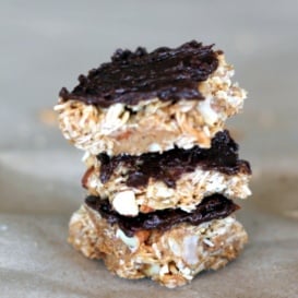 stack of homemade coconut almond granola bars with dark chocolate