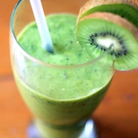 healthy green smoothie in glass with kiwi fruit