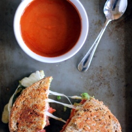 Healthy turkey bacon, avocado, and mozzarella grilled cheese with tomato soup