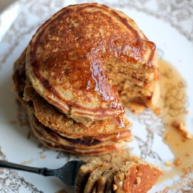 Maple sausage cornmeal pancakes in a stack on a plate