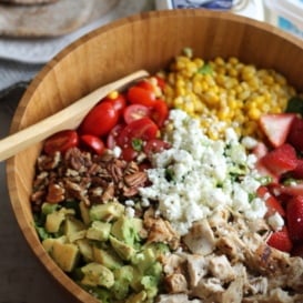 Chicken chopped salad in a wooden bowl