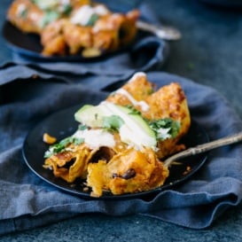 butternut squash black bean enchiladas on a plate