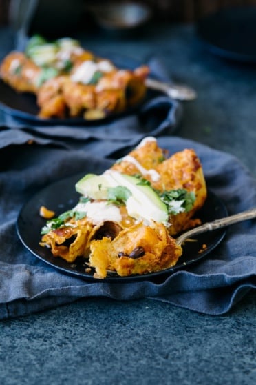 butternut squash black bean enchiladas on a plate