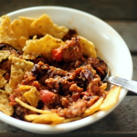 Healthy turkey quinoa chili in a bowl with tortilla chips