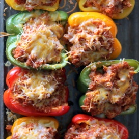 Sloppy joe stuffed bell peppers in a glass baking tray