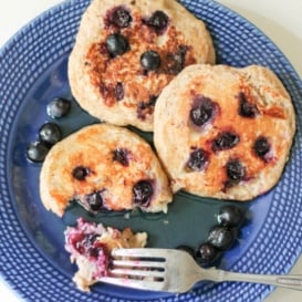 Oatmeal yogurt pancakes with blueberries on a plate with a fork