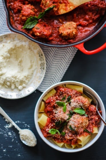 Turkey parmesan meatballs over rigatoni in a bowl