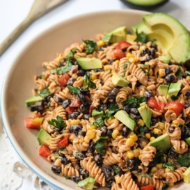 southwest pasta salad with beans, avocado, and vegetables