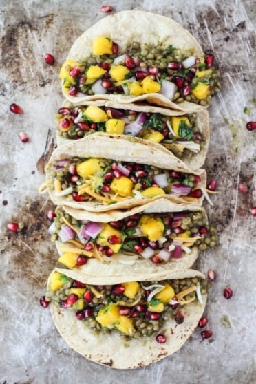 lentil tacos with mango, pomegranate, onion, and cilantro