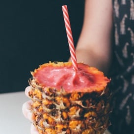 watermelon pineapple smoothie served in a pineapple