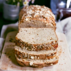loaf of honey oatmeal bread cut into slices