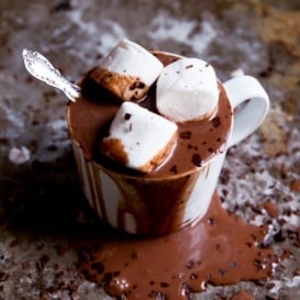 mug of coconut milk hot chocolate with whipped cream