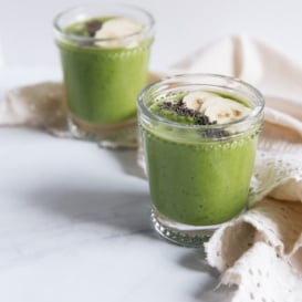 green goddess smoothie in two glasses