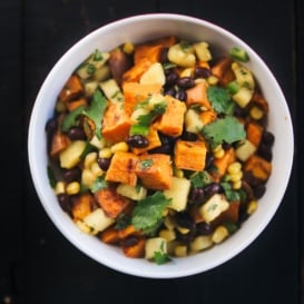 roasted sweet potato salad with black beans and pineapple salsa in a bowl