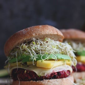 Quinoa beet burgers with mango and sprouts