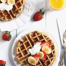 Greek yogurt waffles topped with strawberries and banana slices