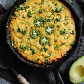 chicken tamale pie topped with cornbread in a skillet