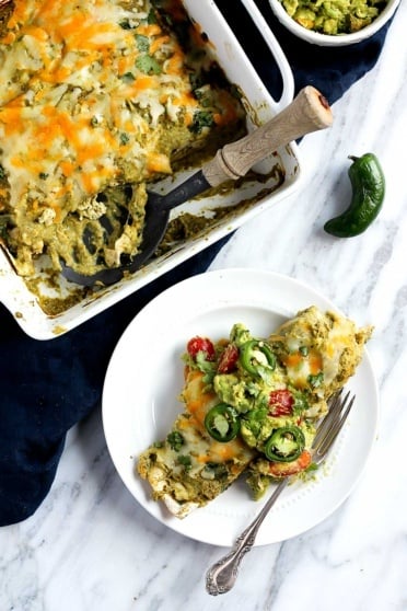 Salsa Verde Chicken Enchiladas on a plate and in a square pan