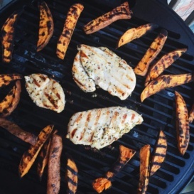 chicken and sweet potato fries on a grill