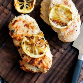 marinated grilled chicken on a wooden board