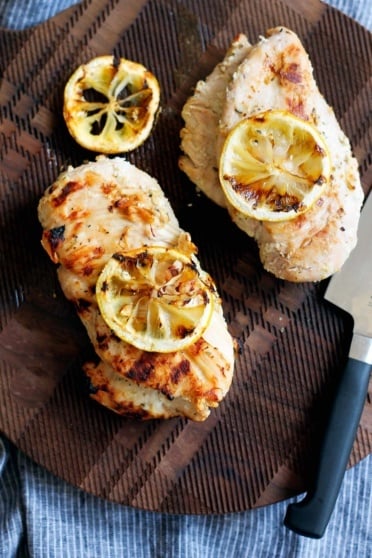 marinated grilled chicken on a wooden board
