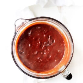 healthy Homemade Enchilada sauce in a glass measuring cup