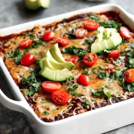 Low carb chicken zucchini enchilada bake in a square pan