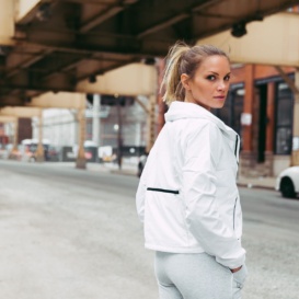 monique posing in a white windbreaker