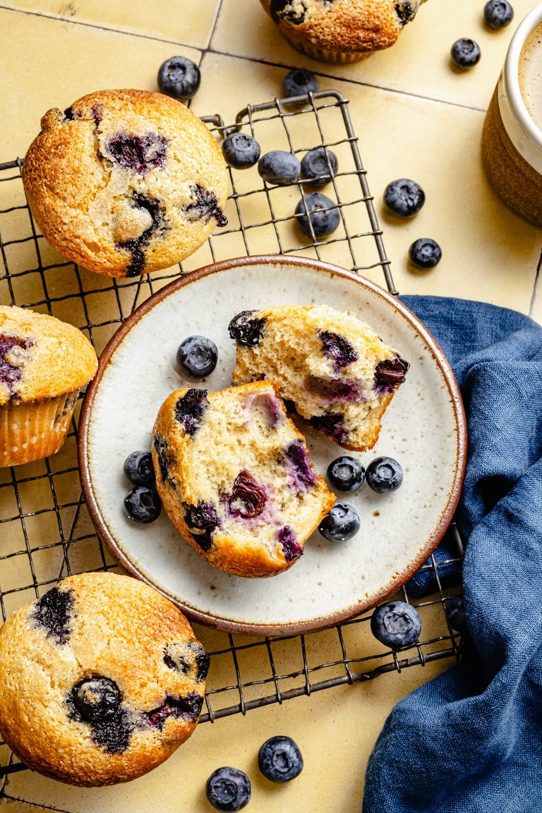 healthy blueberry yogurt muffin cut in half on a plate