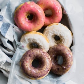 Baked coconut donuts with a sweet berry glaze