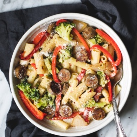 garlic parmesan rigatoni with chicken sausage and veggies in a bowl