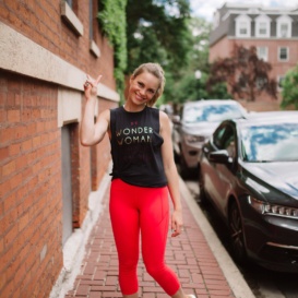 monique in red leggings on a stone street