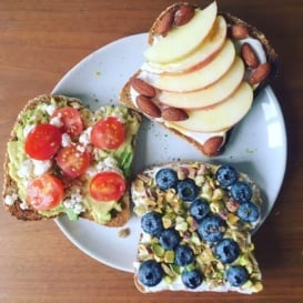three slices of toast with different toppings