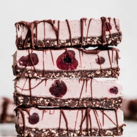 vegan cherry cheesecake bars in a stack