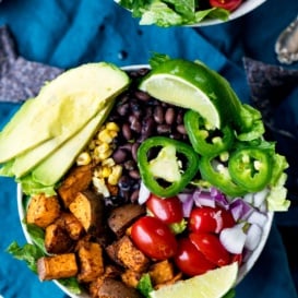 black bean sweet potato taco bowl topped with avocado