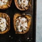 breakfast acorn squash on a baking sheet