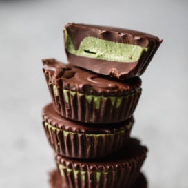 matcha dark chocolate coconut butter cups in a stack